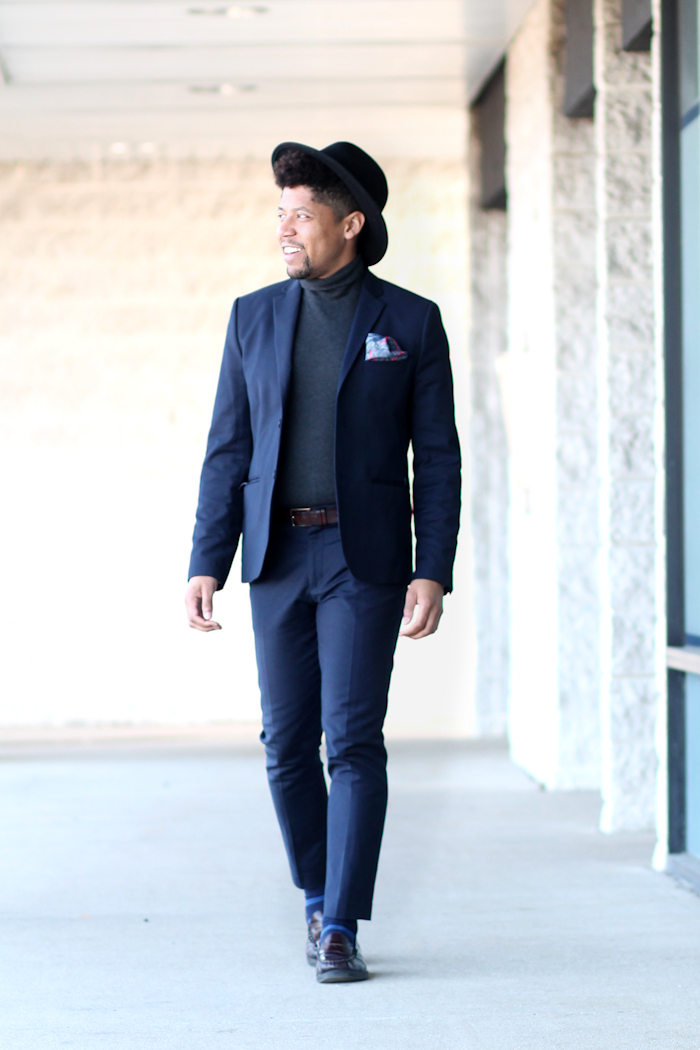 black turtleneck navy suit